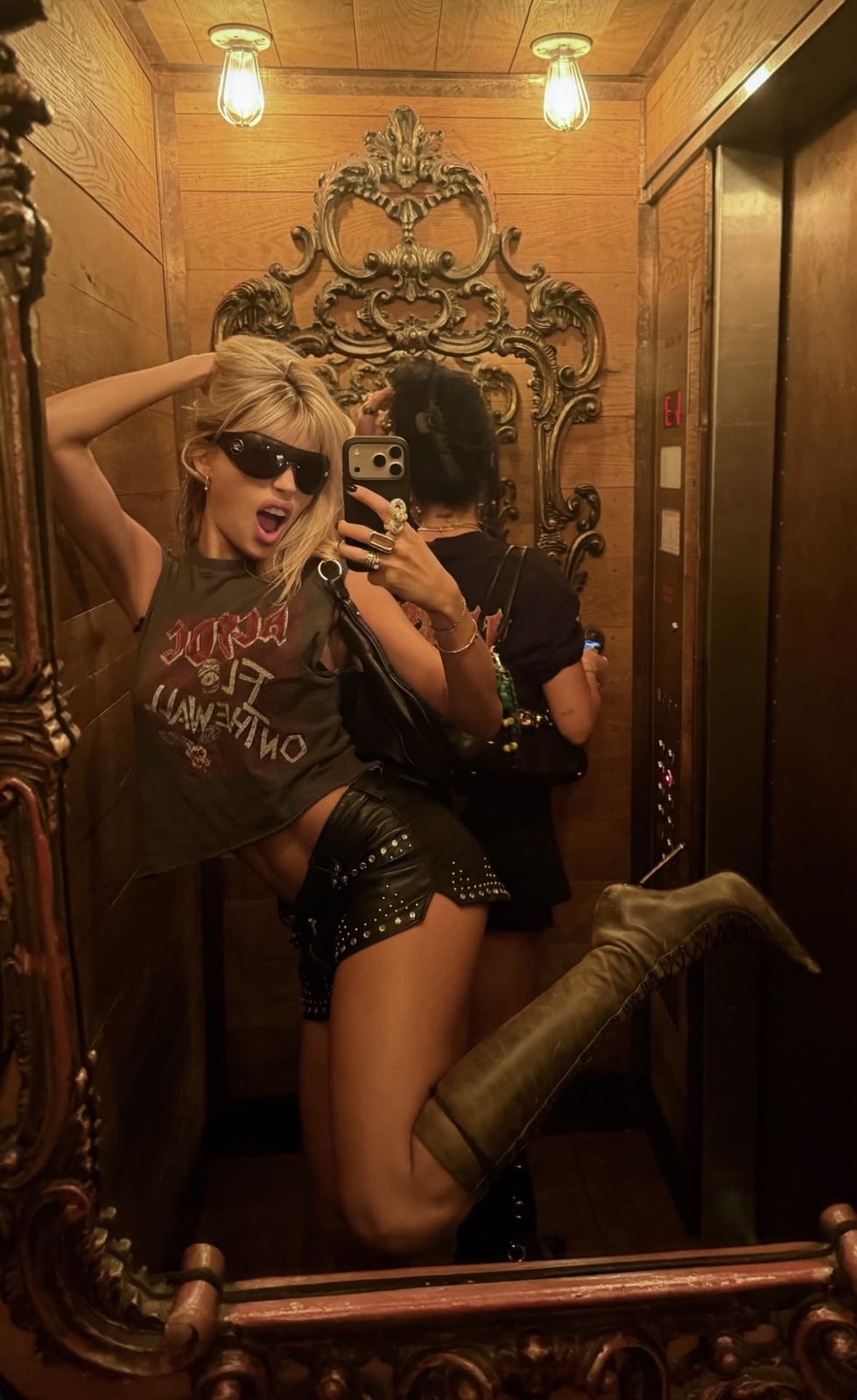 A mirror selfie in a vintage lift