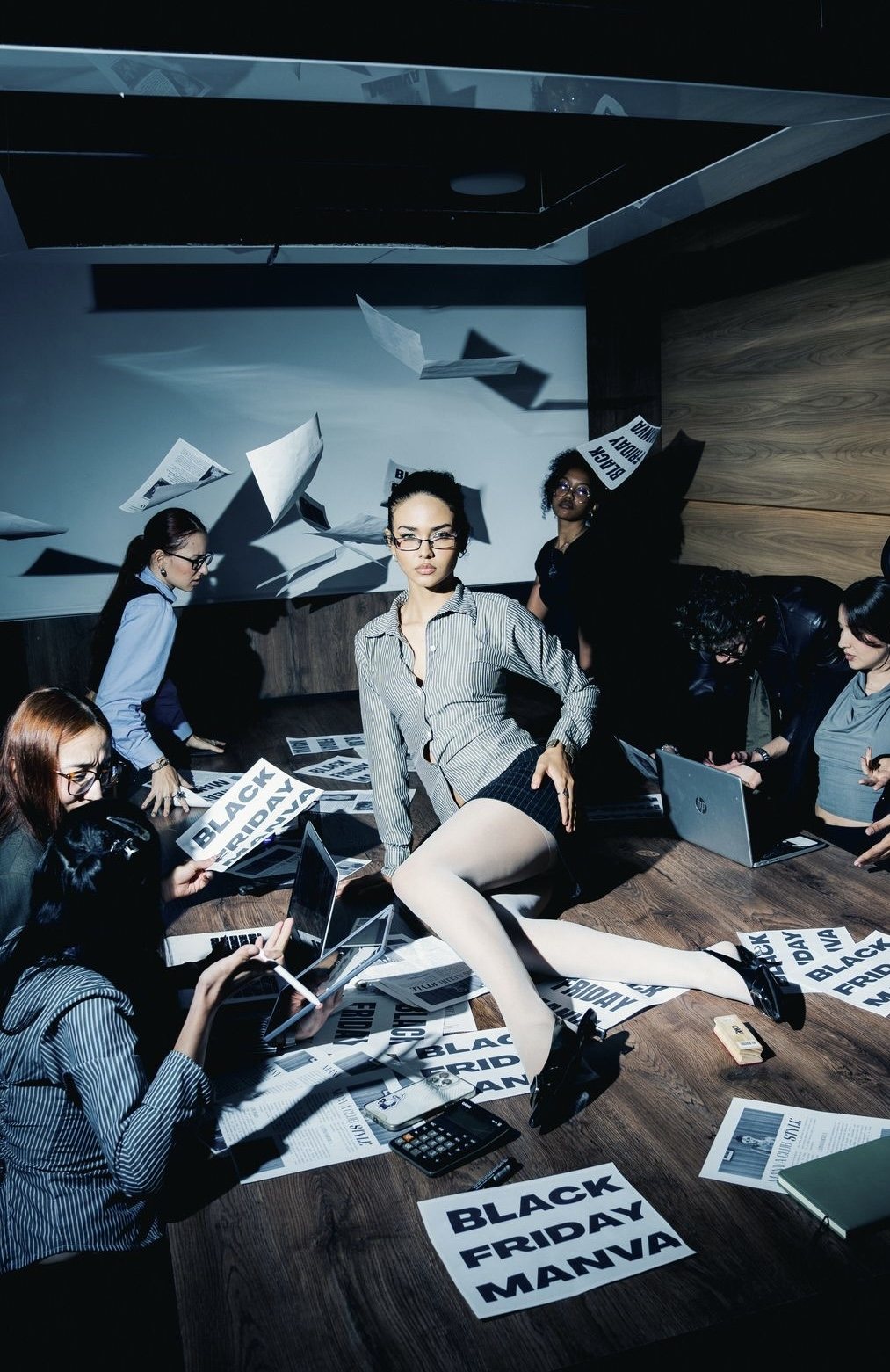 An editorial office shoot with papers flying